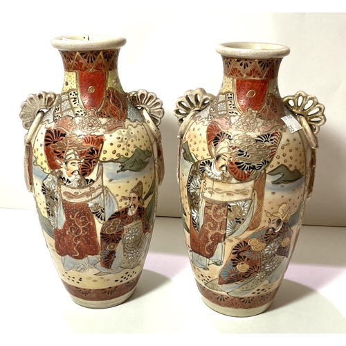 461 - A pair of late Satsuma baluster vases decorated with figures in green, blue and red (1 rim repaired)... 