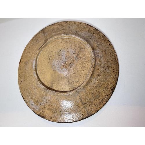 476 - An early 20th century glazed stoneware circular plaque decorated with fish, unmarked, 33cm