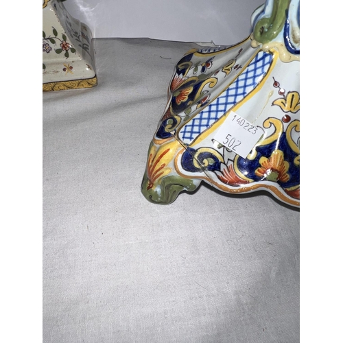 502 - A pair of Italian majolica candle sticks and a similar fan shaped vase (a.f)