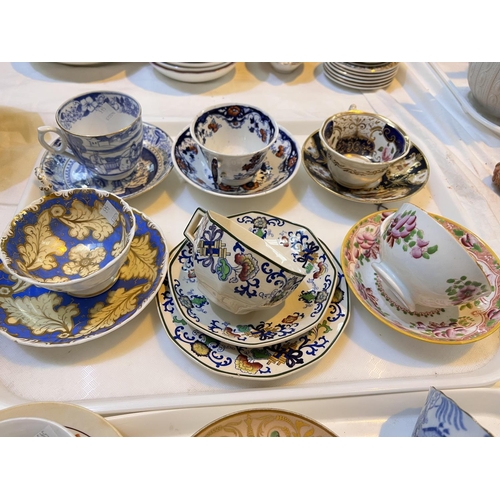 543 - A selection of 19th century cups; saucers; trio sets; etc., includes a Crown Derby example