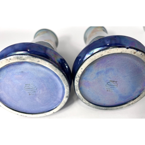 554 - A pair of Shelley 1930's blue and purple lustre vases decorated with gllt butterflies, no 8356, heig... 