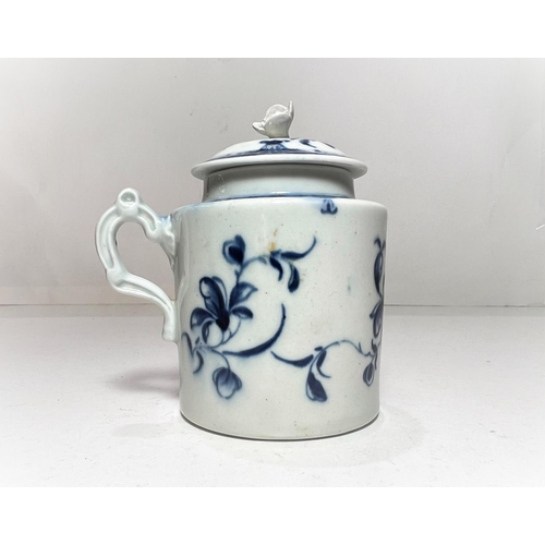 563 - A first period Worcester covered mug with relief flower finial, decorated in blue & white with t... 