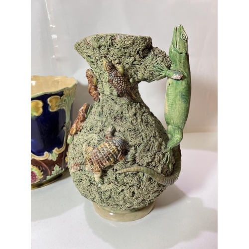 564 - A 19th century Palissy jug encrusted with lizards and frogs, height 30cm (1 head missing)Two Eichwal... 