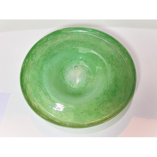 577 - A Scottish art circular fruit dish in green glass with bubble inclusions, diameter 36cm, a large Mon... 