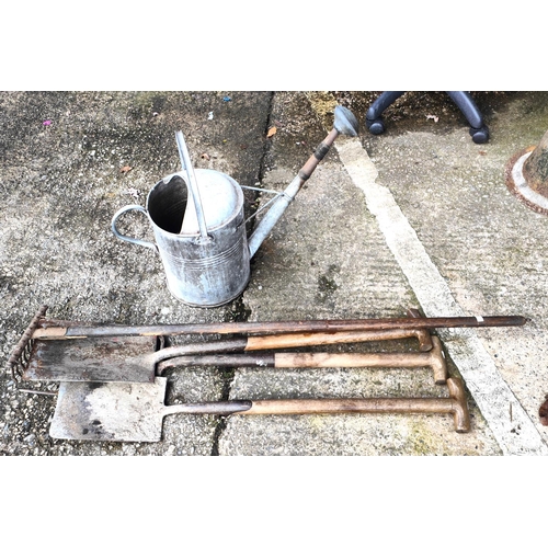 5A - A galvanised steel vintage watering can and a selection of vintage garden tools