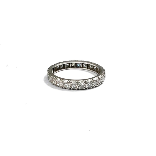 652 - A white metal eternity ring with diamonds in illusion settings, size L, gross 3.3gm