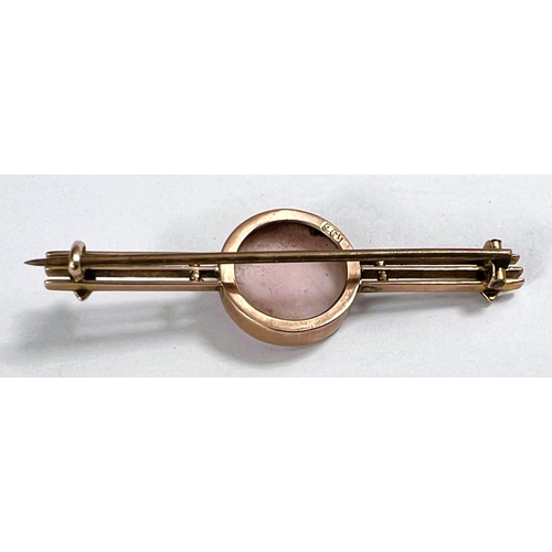 657 - A 9ct gold cameo brooch with pink and white female head and seed pearls to either side