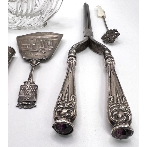 659B - A pair of white metal handled and stone set early 20th century curling tongs other similar items