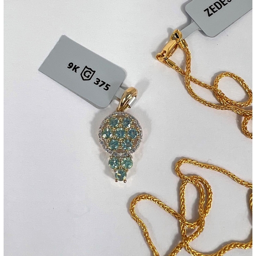 664 - An Aquaiba Beryl pendant with white zircon chips in 9 k gold setting (10 Beryl stones approx.1 carat... 