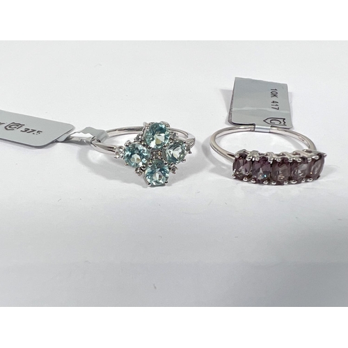 672 - A white gold ring set with Aquaiba Beryl and white zircon stones, size N/O;  a white gold ring ... 