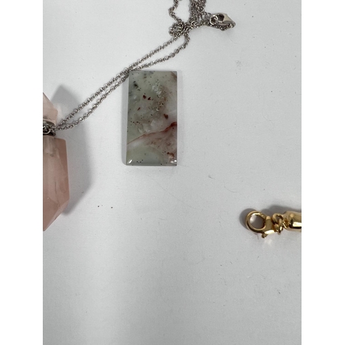 677 - A 21.6 Aquaprase rectangular stone; a pink quartz pendant perfume holder with screw on chain top; a ... 