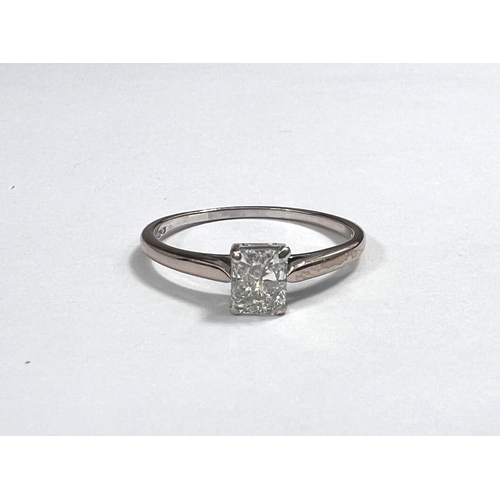 686 - A lady's solitaire diamond ring, the square diamond approximately 0.35 carat, set in 18 carat gold, ... 