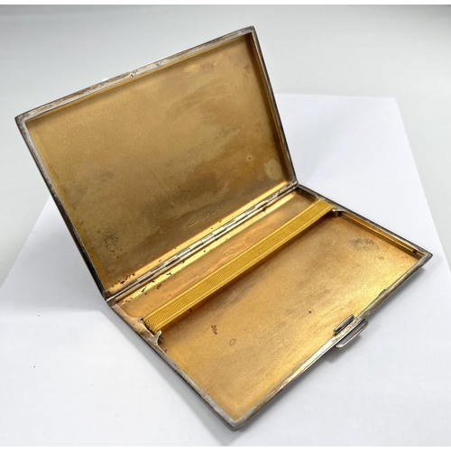 701 - A hall marked silver engine turned cigarette case, monogrammed with slip case, 13x8cm, Birmingham 19... 