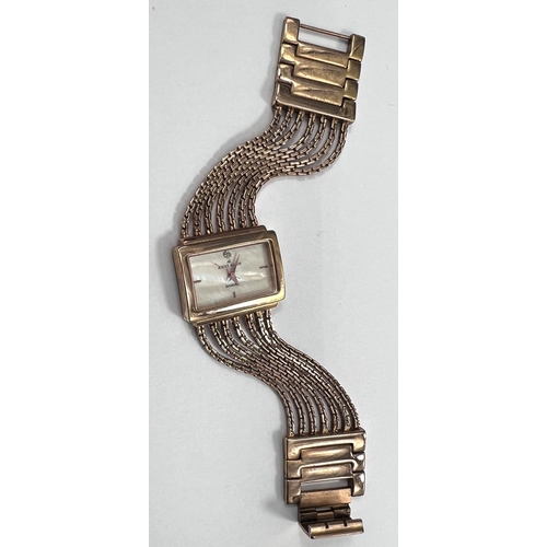 716 - A lady's dress watch by Anne Klein, in gilt metal with 5 strand woven strap and 'lifetime' batt... 