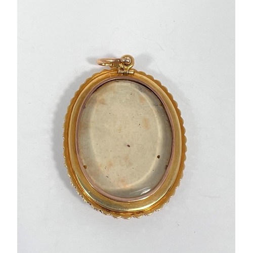 721 - A miniature painted portrait of a 19th century gentleman with seed pearl and yellow metal surround w... 