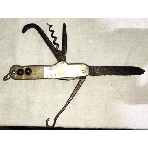 375B - A Boer War period Cavalry / coachmans pocket knife with detachable saddle studs, blades. corkscrew, ... 