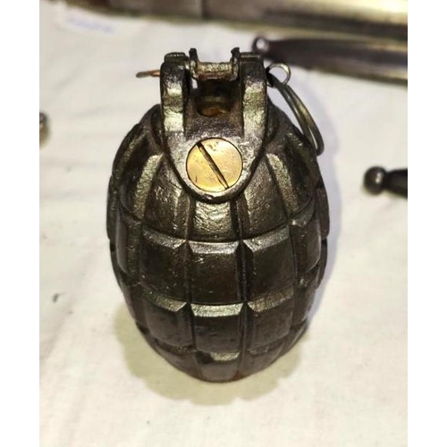 380 - An Inert WWII No 23 MK I Mills Bomb hand grenade, with base plug, height 10cm