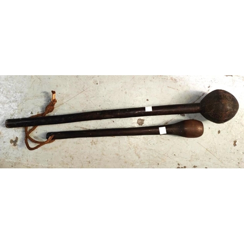 381C - Two Fijian tribal throwing clubs with carved geometric pattern heads (some areas of loss) lengths 56... 