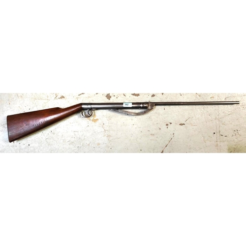 382 - A 'Tell' air rifle with steel body and wooden stock slightly curved cocking mechanism, No 1309 101cm... 