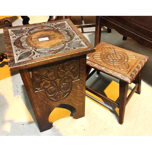 922 - An Art Nouveau oak stool/ work box with carved decoration, flowers and grapes with hinged top, and a... 