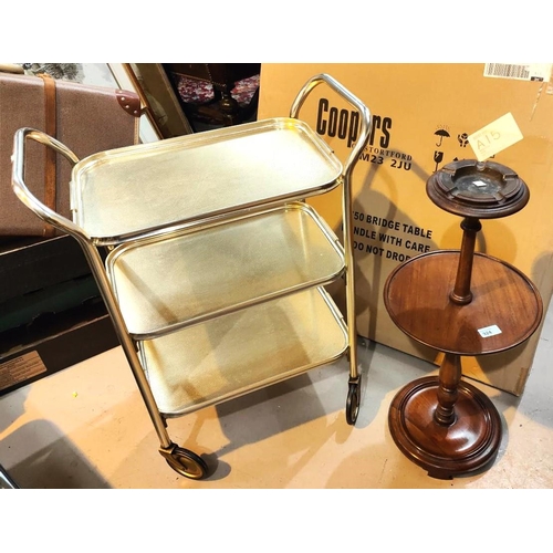 924 - A mahogany two tier circular occasional/smokers table with turned column, a 1950's gilt drinks troll... 