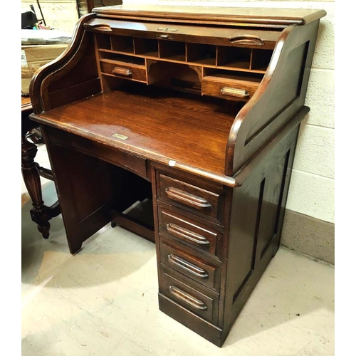 931 - A 1930's oak roll top desk with single column of four drawers, fitted interior, width 92cm depth 67c... 