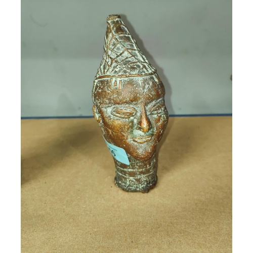 356 - A Nigerian Benin brass bust of a man in pointed hat, height 16.5cm