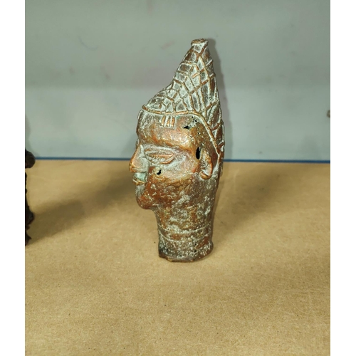 356 - A Nigerian Benin brass bust of a man in pointed hat, height 16.5cm