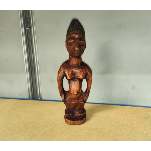 359 - A Yoruba female Ibeji wooden figure with detailed face and blueish hair, height 28cm