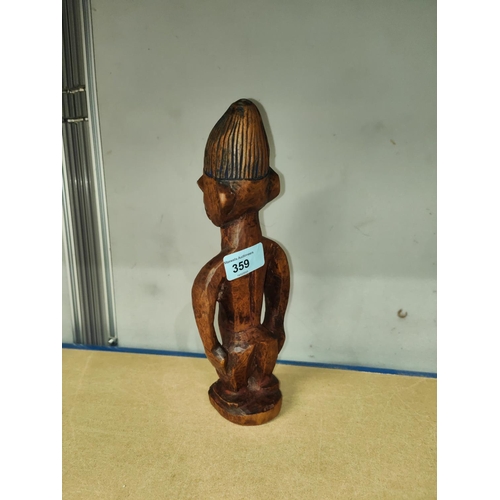 359 - A Yoruba female Ibeji wooden figure with detailed face and blueish hair, height 28cm