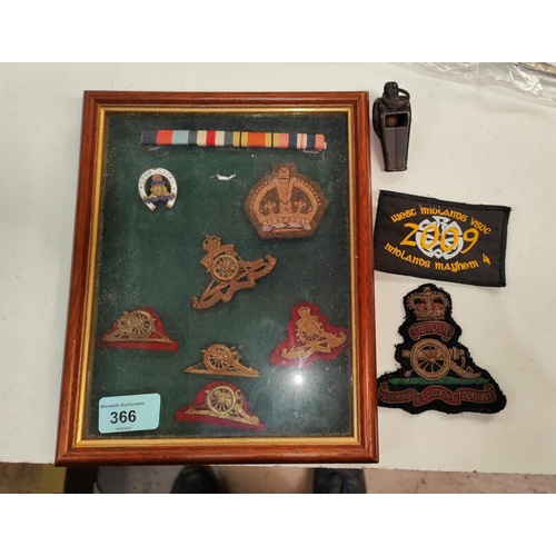 366 - A small collection of framed military badges and patches etc