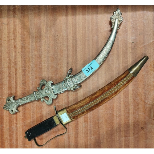 372 - A silver plated Middle Eastern style knife and another