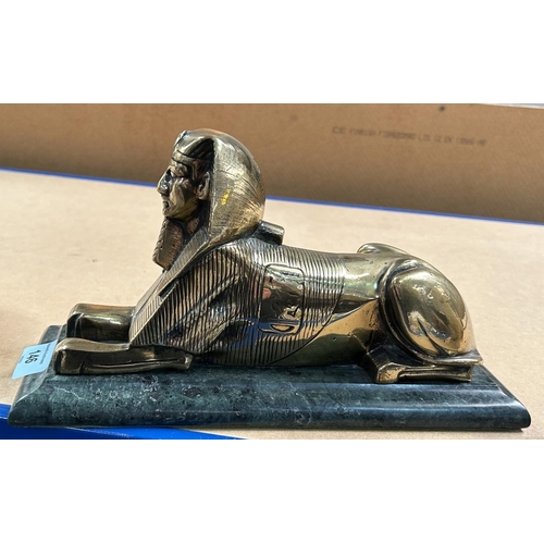 146 - EGYPTIAN SPHINX, cast brass figure on rectangular green marble base, 15cm high, base 28 x 10cm