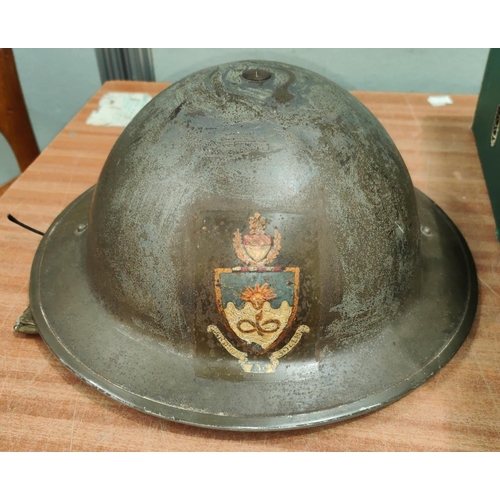 322 - A WWII Civil Defence on Fire Wardens Helmet with crest for the Victoria University of Manchester.