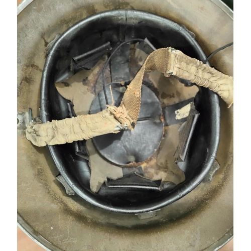 322 - A WWII Civil Defence on Fire Wardens Helmet with crest for the Victoria University of Manchester.