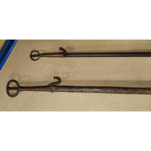 361 - Two South Nigerian Nusubi tribe Iron currency spears, with split central section with hook ends, len... 