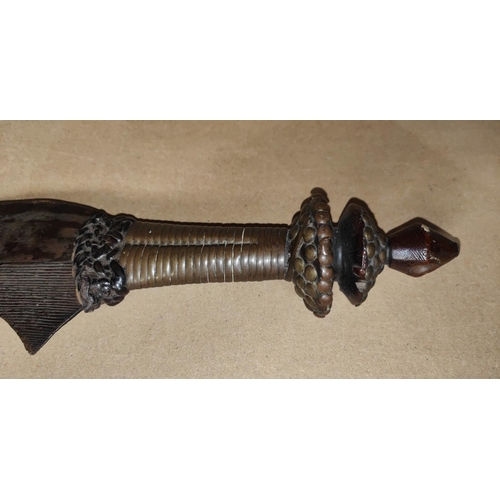 363 - A Ngombe or Bangala Executioners sword with sickle shaped blade, incised decoration to the blade, br... 