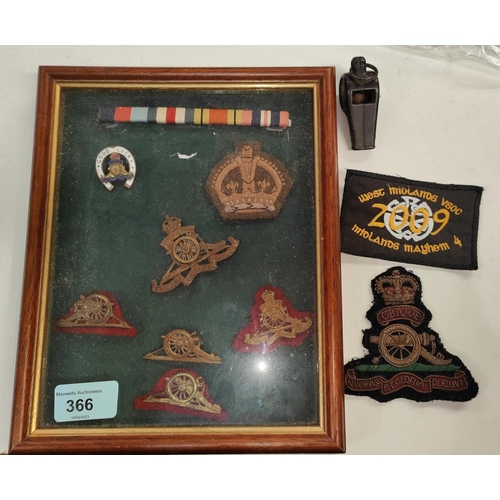 366 - A small collection of framed military badges and patches etc