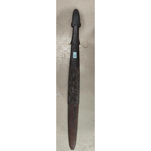 370 - A South Pacific islands carved wood Massim style sword club tapering blade end with central carved d... 