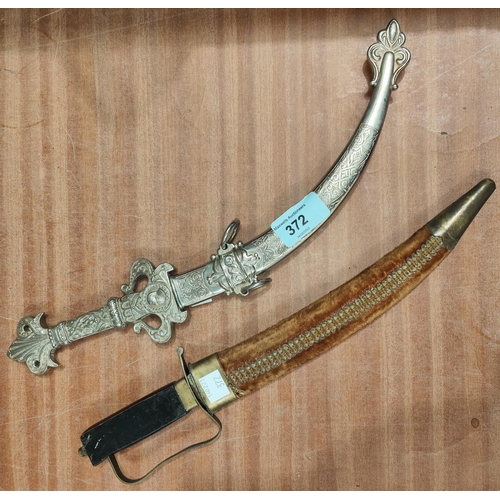 372 - A silver plated Middle Eastern style knife and another