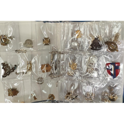 387 - A collection of military badges