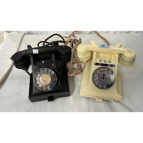 66 - Two mid 20th century vintage telephones, black and ivory