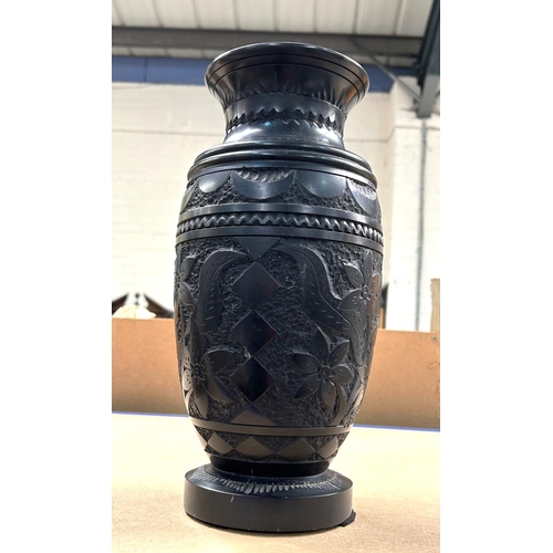 78 - A 19th century Ebony Vase carved with flowers etc. and concentric banding, height ? (body has hairli... 