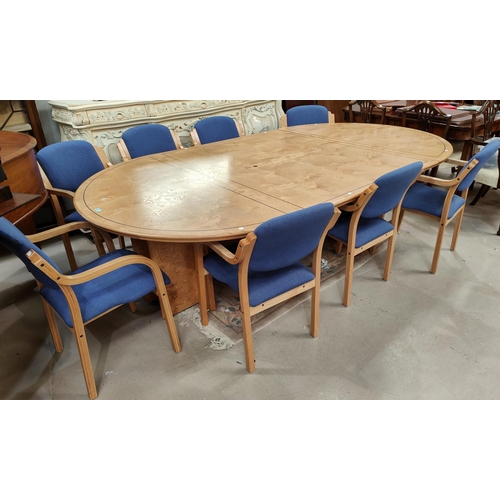 873 - A modern figured ash dining/boardroom suite comprising extending circular dining table and 8 dining ... 