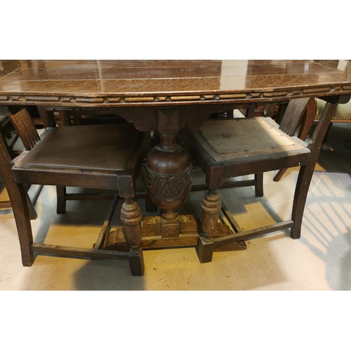 917 - A 1930's carved oak dining suite on bulbous legs comprising: Draw leaf table, 4 chairs and sideboard... 