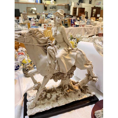 535 - A large resin group:  Lady on horseback; a Capodimonte style large pedestal comport supported b... 