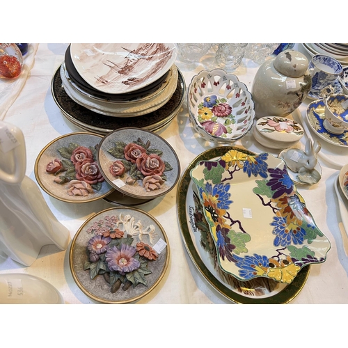 536 - A selection of decorative plates; figures; etc.