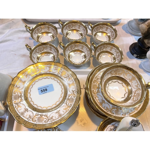 559 - A 40 piece Cauldon gilt part tea service with milk, sugar, cups, saucers, cake plates etc