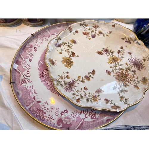 570 - Two 19th century large blue & white meat platters; a wall plaque in red and white willow pattern... 