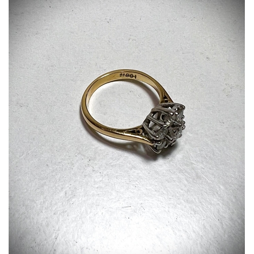 624 - An 18ct hallmarked gold ring set with 7 diamonds in a flowerhead cluster, approximate diamond weight... 